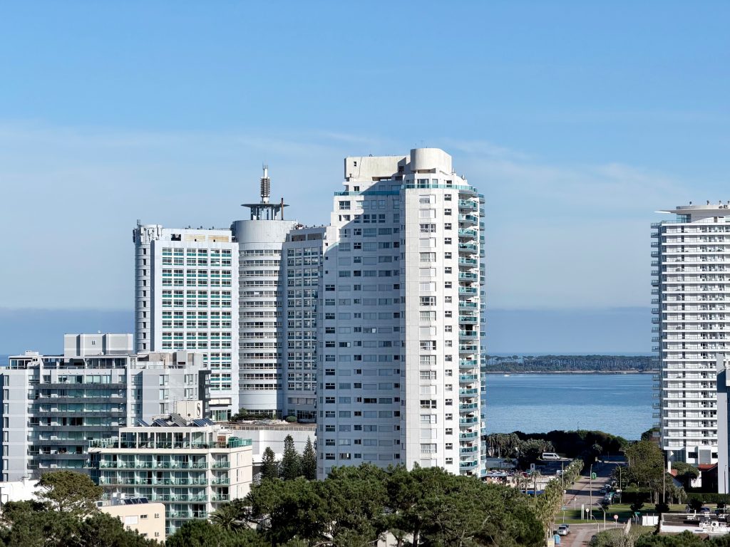 Panoramic view of high-rise buildings near the ocean in Punta del Este, Uruguay, showcasing urban architecture.